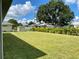 Large backyard with grassy lawn and storage shed at 23466 Garrett Ave, Port Charlotte, FL 33954