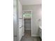 Spa-like bathroom with walk-in shower, subway tile, and built-in shelving at 23466 Garrett Ave, Port Charlotte, FL 33954