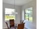 Bright dining area with a view and wicker chairs at 23466 Garrett Ave, Port Charlotte, FL 33954