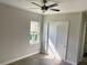 Light and airy bedroom with sliding door and window at 23466 Garrett Ave, Port Charlotte, FL 33954