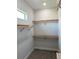 Spacious walk-in closet with ample shelving at 23466 Garrett Ave, Port Charlotte, FL 33954