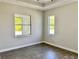 Bright bedroom with tile floors and multiple windows at 23466 Garrett Ave, Port Charlotte, FL 33954