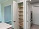 Walk-in pantry with light wood shelves at 23466 Garrett Ave, Port Charlotte, FL 33954