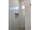 Clean shower with subway tile and a niche for toiletries at 23466 Garrett Ave, Port Charlotte, FL 33954