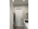 Laundry room with black refrigerator and white cabinets at 23466 Garrett Ave, Port Charlotte, FL 33954