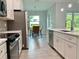 Modern kitchen with white cabinets and stainless steel appliances at 23466 Garrett Ave, Port Charlotte, FL 33954