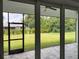 Spacious screened patio overlooking a large backyard at 23466 Garrett Ave, Port Charlotte, FL 33954