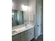 Modern bathroom features double sinks, marble countertop, and sleek fixtures at 23466 Garrett Ave, Port Charlotte, FL 33954