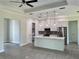 Modern kitchen with island, stainless steel appliances, and white cabinetry at 23466 Garrett Ave, Port Charlotte, FL 33954
