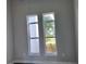 Well-lit bedroom with large windows offering backyard views at 23466 Garrett Ave, Port Charlotte, FL 33954