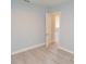 Bright bedroom with light gray walls and wood-look flooring at 2852 60Th N Ave, St Petersburg, FL 33714