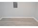 Clean, empty basement space with gray vinyl flooring at 2852 60Th N Ave, St Petersburg, FL 33714