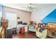 Bedroom with a desk and seating area at 11519 Misty Isle Ln, Riverview, FL 33579