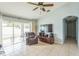 Gathering room with sliding glass doors and backyard access at 11519 Misty Isle Ln, Riverview, FL 33579