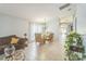 Open living and dining area with tile floors and large windows at 11519 Misty Isle Ln, Riverview, FL 33579