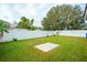 Grass yard with a patio area at 11519 Misty Isle Ln, Riverview, FL 33579