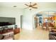 Living room with open floor plan and view of kitchen and dining area at 11519 Misty Isle Ln, Riverview, FL 33579