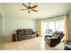 Gathering room with sliding glass doors leading to the backyard at 11519 Misty Isle Ln, Riverview, FL 33579