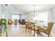Bright dining area with glass-top table and seating for four at 11519 Misty Isle Ln, Riverview, FL 33579