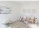 Cozy sitting area with neutral tones, decorative wall art, and modern furnishings at 232 Vistera Blvd, Nokomis, FL 34275