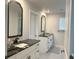 Stylish bathroom with dual vanities, granite countertops, and modern fixtures at 3522 N Maryland Ave, Plant City, FL 33565