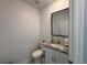 Powder room features a granite countertop vanity and modern fixtures at 3522 N Maryland Ave, Plant City, FL 33565