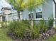 Landscaped front yard of a home with well manicured plants and grass at 3522 N Maryland Ave, Plant City, FL 33565