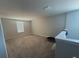 Bright loft area with neutral carpet and natural light at 3522 N Maryland Ave, Plant City, FL 33565