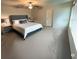 Serene main bedroom with neutral carpet, large windows, and elegant furnishings at 3522 N Maryland Ave, Plant City, FL 33565