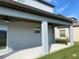 Covered patio with ceiling fans, ideal for outdoor lounging and entertaining, enhances the backyard space at 3522 N Maryland Ave, Plant City, FL 33565