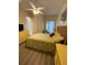 Main bedroom with king-size bed, access to balcony, and ceiling fan at 10307 Coral Landings Lane N Ln # 10, Placida, FL 33946