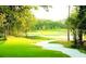 Lush green golf course with sand traps at 14071 Heritage Landing Blvd # 334, Punta Gorda, FL 33955