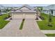 Two-story home with a double-wide driveway and manicured lawn at 18019 Cherished Loop, Bradenton, FL 34211