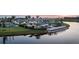 Community boasts a clubhouse, pool, and lakefront views at sunset at 18019 Cherished Loop, Bradenton, FL 34211