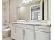 Modern bathroom with white cabinets and quartz countertop at 18019 Cherished Loop, Bradenton, FL 34211