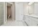 Bathroom with double vanity, marble countertop, and separate toilet area at 18019 Cherished Loop, Bradenton, FL 34211