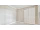 Well-lit bedroom with neutral walls and white doors at 18019 Cherished Loop, Bradenton, FL 34211