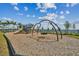 Modern playground with slides, swings, and climbing wall at 1925 Transom Ln, Sarasota, FL 34240