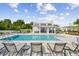 Relaxing pool area with lounge chairs and a cabana at 338 Via Anina Dr, Sarasota, FL 34243