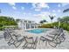 Relaxing pool area with lounge chairs and cabana at 342 Via Anina Dr, Sarasota, FL 34243