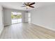 Bright bedroom with sliding glass doors leading to the pool area at 416 Gulf Breeze Blvd, Venice, FL 34293