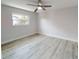 Empty bedroom with new flooring, fresh paint, and large windows at 416 Gulf Breeze Blvd, Venice, FL 34293