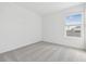 A cozy bedroom features soft carpet and a view from a light-filled window at 7440 Cabin Ln, Sarasota, FL 34240