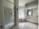 Bathroom with shower, bathtub, and double vanity at 750 Pond Lily Way, Venice, FL 34293