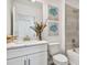 Bathroom vanity with elegant marble countertop, and shower with tiled walls at 16896 Fiesta Dr, Port Charlotte, FL 33953