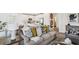 Cozy living room with a view of the modern, white kitchen at 16896 Fiesta Dr, Port Charlotte, FL 33953