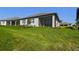 Lush backyard with a screened-in lanai at 18063 Cherished Loop, Bradenton, FL 34211