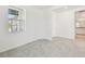 Bedroom featuring hard flooring and view to en suite bathroom and hallway at 18063 Cherished Loop, Bradenton, FL 34211