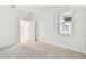 Bright bedroom with neutral paint and carpet, ready for personal touches at 18063 Cherished Loop, Bradenton, FL 34211