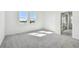 Carpeted bedroom with two windows and views of the lake at 18063 Cherished Loop, Bradenton, FL 34211